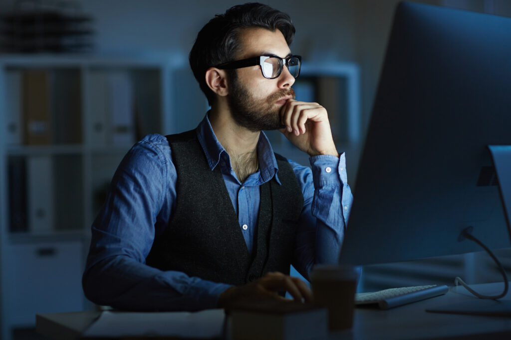 Professional working late at a computer